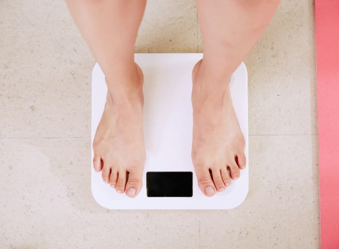 Person standing on a weighing machine