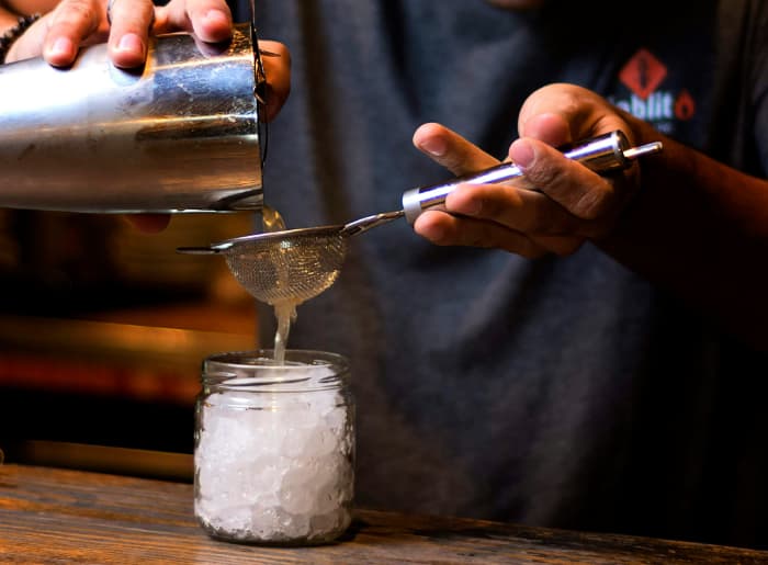 Bartender pouring a drink