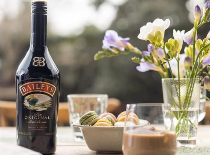 Baileys Original Irish Cream bottle with information about shelf life, refrigeration and proper storage