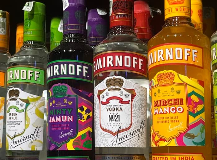 Flavoured vodka and regular vodka bottles compared for alcohol content, sugar and labeling differences