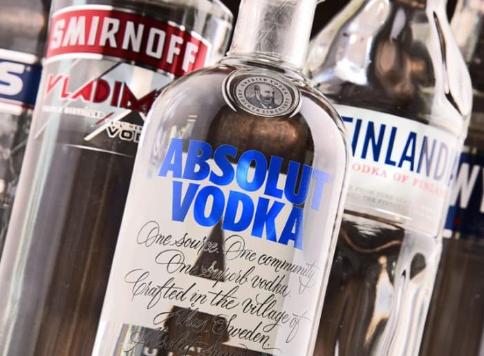 Flavoured vodka and regular vodka bottles compared for alcohol content, sugar and labeling differences