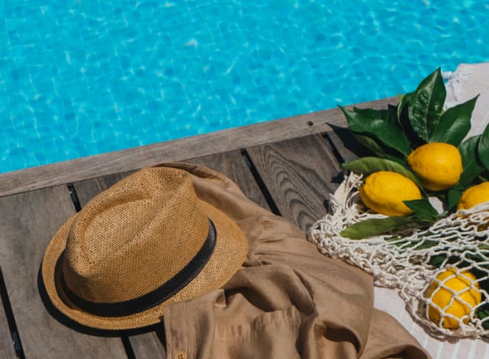 Lemons and a hat by the pool.