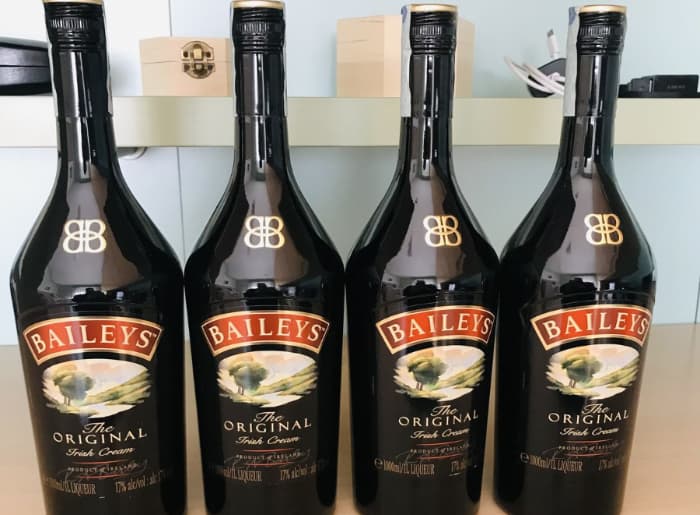 Baileys Original Irish Cream bottle with information about shelf life, refrigeration and proper storage