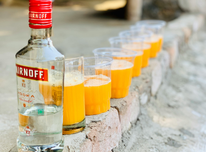 Smirnoff bottle and a few glasses of fruit juice.jpg