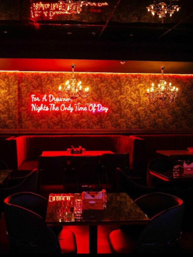 Dimly lit interior of Deja Woo, a bar in Malad.
