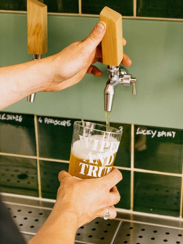 Craft beer filled in a glass through a tap outlet