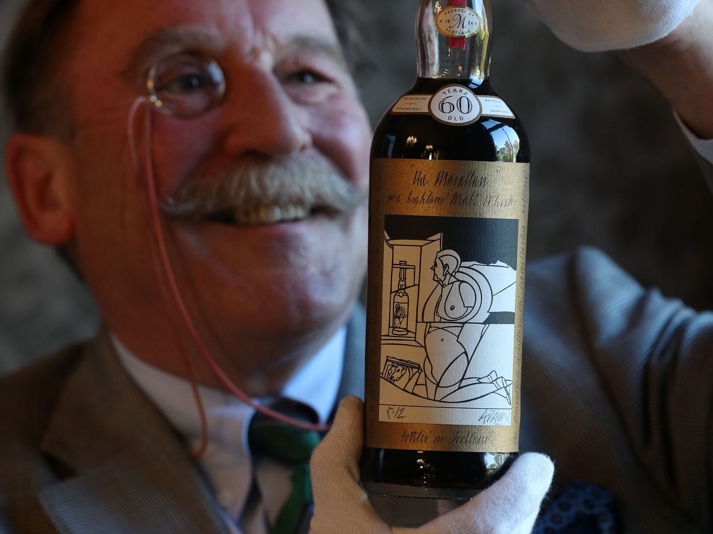 Macallan 1926 being examined before auction