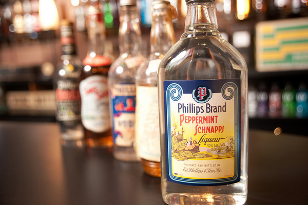 Phillips peppermint schnapps displayed on a bar table
