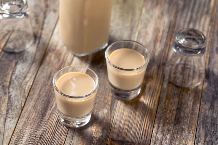 Two shot glasses filled with Baileys irish cream. A perfect drink if you are a first-time drinker. 