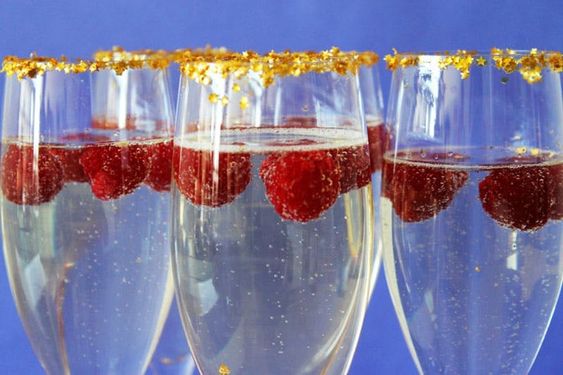 A champagne glass decorated with edible gold flakes.