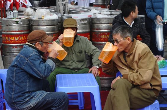 Citizens of Vietnam enjoying the world's cheapest beer.