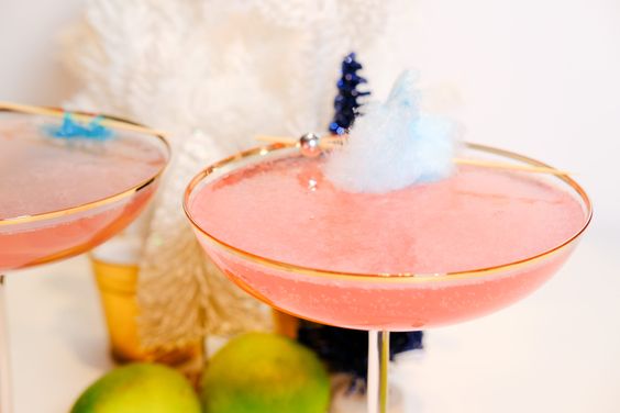 The classic cosmopolitan gets a cotton candy twist in this sweet and pink cocktail.