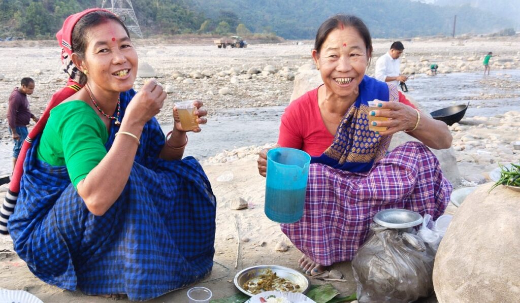 Mising women drinking apong