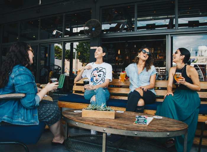 4 women drinking together